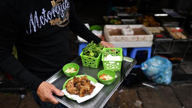 The pancake-shaped patties have been made in northern Vietnam for generations, and are even credited with keeping married couples happy. “If a couple misses even a bite of ‘cha ruoi’ during the season, not only will the wife lament but the husband will surely complain,” author Vu Bang wrote his 1952 book “Hanoi Delicacies”. (Manan Vatsyayana / AFP) The pancake-shaped patties have been made in northern Vietnam for generations, and are even credited with keeping married couples happy. “If a couple misses even a bite of ‘cha ruoi’ during the season, not only will the wife lament but the husband will surely complain,” author Vu Bang wrote his 1952 book “Hanoi Delicacies”. (Manan Vatsyayana / AFP)