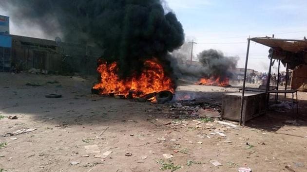 A bonfire is lit along the street during protests against price increases in Atbara, Nile River state in northeastern Sudan on December 20. (REUTERS) A bonfire is lit along the street during protests against price increases in Atbara, Nile River state in northeastern Sudan on December 20. (REUTERS)