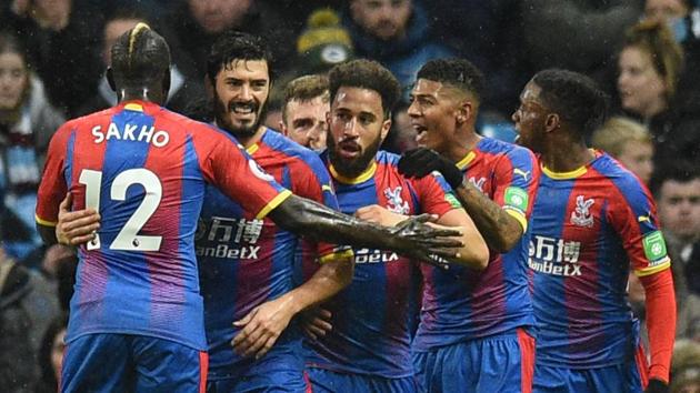 Crystal Palace's English midfielder Andros Townsend (C) celebrates scoring their second goal to take the lead 1-2 during the English Premier League football match between Manchester City and Crystal Palace at the Etihad Stadium.(AFP)