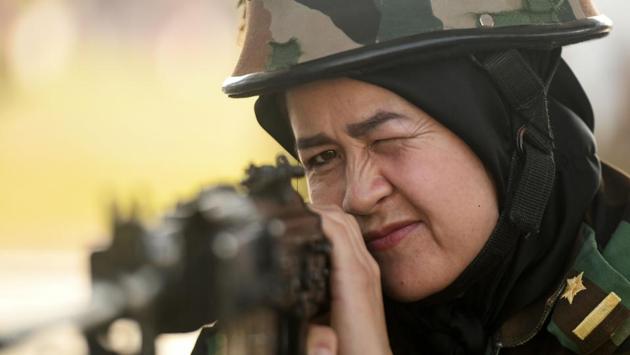 An Afghan woman cadet shoots at a target during a practice session in Chennai, Tamil Nadu during an exchange programme for nineteen Afghan cadets. (Arun Sankar / AFP)