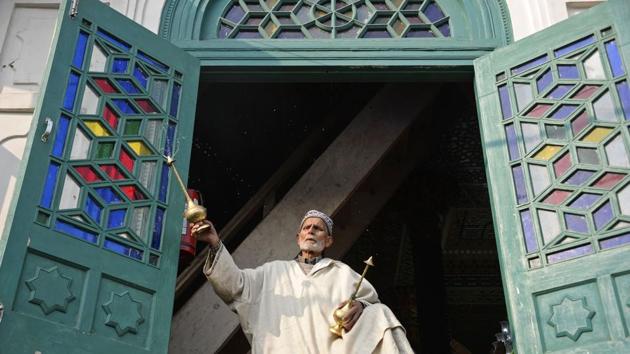 A Muslim priest douses rose water on devotees at the shrine of Sheikh Abdul Qadir Geelani in Srinagar, Jammu and Kashmir. Devotees marked the ‘urs’ or death anniversary of the saint who lived in Baghdad some 1,000 years ago and is buried there. (Tauseef Mustafa / AFP)