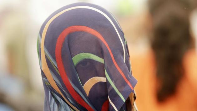 A victim of sexual violence participates in a Dignity March in Mumbai, Maharashtra. The march was held to call for a change in attitude towards victims of sexual violence. (Rajanish Kakade / AP)