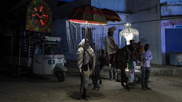 A groom rides a horse on his way to the bride’s house for their wedding ceremony in Orchha, Madhya Pradesh. (Noemi Cassanelli / AFP)