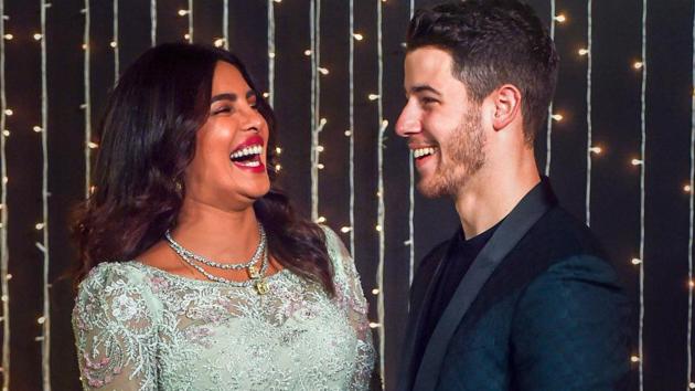 Priyanka Chopra with Nick Jonas during their wedding reception in Mumbai. (PTI Photo/Shashank Parade)(PTI)