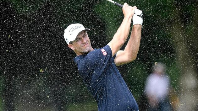 File image of Australia’s Adam Scott playing a shot as the rain falls.(Getty Images)