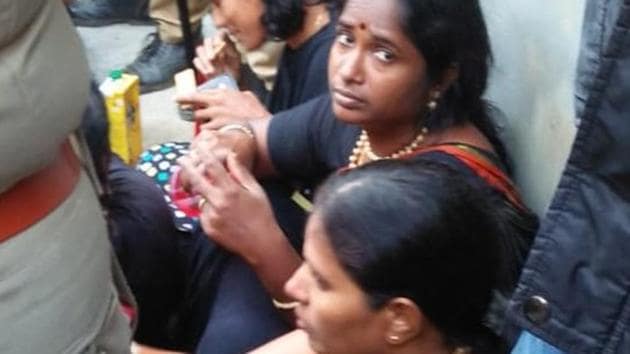 The Sabarimala foothills in Pamba on Sunday witnessed high drama as hundreds of devotees blocked paths and chased away a group of 11 women of menstruating age being escorted to the hill shrine by the police.(ANI)