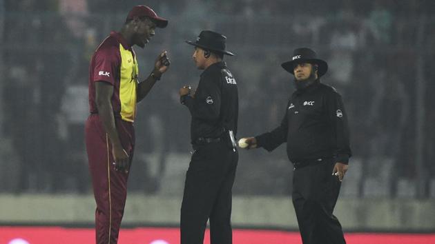 West Indies captain Carlos Brathwaite (L) argues with umpires Masudur Rahman (C) and Tanvir Ahmed (R) during the third Twenty20 against Bangladesh. (AFP) West Indies captain Carlos Brathwaite (L) argues with umpires Masudur Rahman (C) and Tanvir Ahmed (R) during the third Twenty20 against Bangladesh. (AFP)