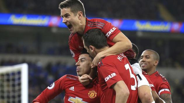 Manchester United midfielder Jesse Lingard, with his teammates celebrates his goal against Cardiff City. (AP) Manchester United midfielder Jesse Lingard, with his teammates celebrates his goal against Cardiff City. (AP)