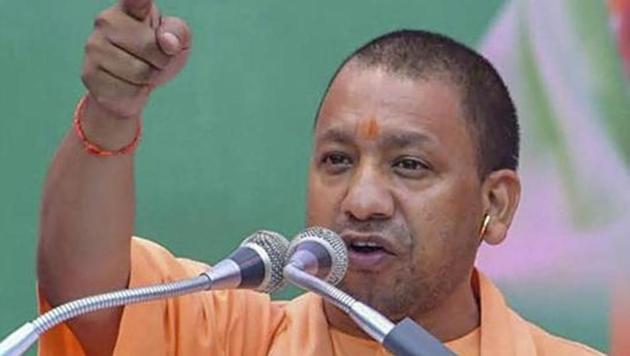A group of youths hurled balled-up handerkerchiefs and traditional towels towards the dais occupied by Uttar Pradesh chief minister Yogi Adityanath.(PTI)