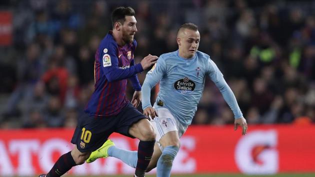 FC Barcelona's Lionel Messi (left) duels for the ball with Celta Vigo's Stanislav Lobotka. (AP) FC Barcelona's Lionel Messi (left) duels for the ball with Celta Vigo's Stanislav Lobotka. (AP)