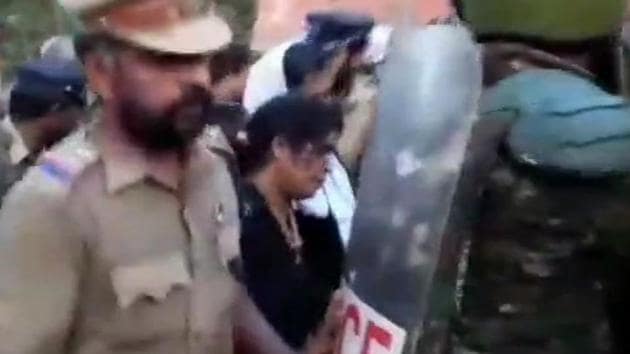 Two women devotees are being brought back to Pampa base camp following protests. They were stopped by protesters at Appachimedu, two kilometres away from SabarimalaTemple.(ANI Photo) Two women devotees are being brought back to Pampa base camp following protests. They were stopped by protesters at Appachimedu, two kilometres away from SabarimalaTemple.(ANI Photo)