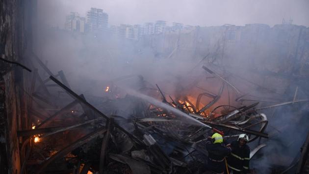 Rescuers have found the bodies of four workers today after Sunday’s fire in a clothes factory in Mumbai’s Damu Nagar. The workers died after a structure of the factory collapsed due to the fire, which broke out in three shops of Ramlut Garment Company near MIDC bus stop on Sunday. Mumbai Police have arrested the contractor and supervisor of the building. (Pramod Thakur / HT File) Rescuers have found the bodies of four workers today after Sunday’s fire in a clothes factory in Mumbai’s Damu Nagar. The workers died after a structure of the factory collapsed due to the fire, which broke out in three shops of Ramlut Garment Company near MIDC bus stop on Sunday. Mumbai Police have arrested the contractor and supervisor of the building. (Pramod Thakur / HT File)