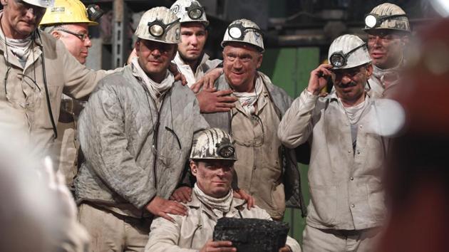 Straining to hold back tears, their once-white helmets and overalls smeared with dust, seven miners in Germany held the symbolic last chunk of “black gold” hauled up from 1,000 meters below. Germany closed its last black coal mine on Friday, paying an emotional tribute to a 200-year-old industry that once fuelled the country’s economic growth but lost out to foreign competitors. (Patrik Stollarz / AFP) Straining to hold back tears, their once-white helmets and overalls smeared with dust, seven miners in Germany held the symbolic last chunk of “black gold” hauled up from 1,000 meters below. Germany closed its last black coal mine on Friday, paying an emotional tribute to a 200-year-old industry that once fuelled the country’s economic growth but lost out to foreign competitors. (Patrik Stollarz / AFP)