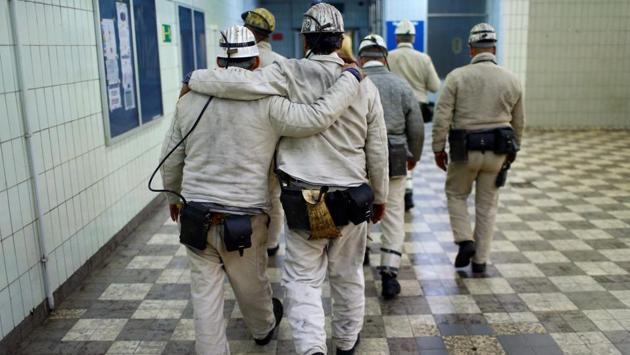 Toward the end of Friday’s ceremony, miners paid their respects to colleagues who lost their lives underground. The dangers were highlighted Monday, when a 29-year-old worker was crushed to death by a metal door in the Ibbenbueren shaft. And overnight Friday, news emerged of the deaths of 13 miners in an explosion at a colliery in the Czech Republic. (Thilo Schmuelgen / REUTERS) Toward the end of Friday’s ceremony, miners paid their respects to colleagues who lost their lives underground. The dangers were highlighted Monday, when a 29-year-old worker was crushed to death by a metal door in the Ibbenbueren shaft. And overnight Friday, news emerged of the deaths of 13 miners in an explosion at a colliery in the Czech Republic. (Thilo Schmuelgen / REUTERS)