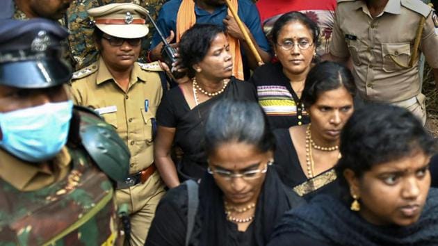 Members of the Chennai-based "Manithi" wait at the foothills of the Lord Ayyappa Temple as devotees protested against their attempt to trek the shrine, at Pamba, in Pathanamthitta, Dec. 23, 2018. (PTI) Members of the Chennai-based "Manithi" wait at the foothills of the Lord Ayyappa Temple as devotees protested against their attempt to trek the shrine, at Pamba, in Pathanamthitta, Dec. 23, 2018. (PTI)