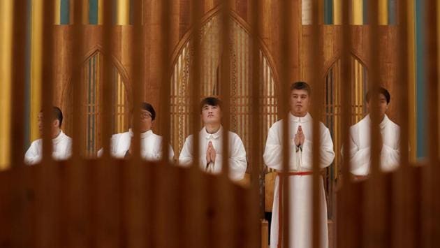 Acolytes attend a mass at Xishiku Cathedral, also known as the North Cathedral, on Christmas Eve in Beijing, China. At least four Chinese cities and one county have ordered Christmas decorations banned this year, amid a growing emphasis on traditional culture by the ruling Communist Party. (Jason Lee / REUTERS) Acolytes attend a mass at Xishiku Cathedral, also known as the North Cathedral, on Christmas Eve in Beijing, China. At least four Chinese cities and one county have ordered Christmas decorations banned this year, amid a growing emphasis on traditional culture by the ruling Communist Party. (Jason Lee / REUTERS)
