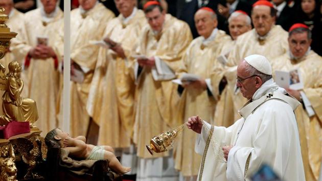 While leading a service in St Peter’s Basilica in the Vatican for the traditional Christmas Eve Mass, Pope Francis condemned the huge divide between the world’s rich and poor, saying Jesus’ birth in poverty in a stable should make everyone reflect on the meaning of life. He also called on people in developed countries to live simpler and less materialistic lives. (Max Rossi / REUTERS) While leading a service in St Peter’s Basilica in the Vatican for the traditional Christmas Eve Mass, Pope Francis condemned the huge divide between the world’s rich and poor, saying Jesus’ birth in poverty in a stable should make everyone reflect on the meaning of life. He also called on people in developed countries to live simpler and less materialistic lives. (Max Rossi / REUTERS)
