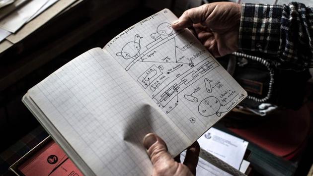 A book with toys’ plans and instructions Collino drew and wrote. He sketches the objects residents describe, builds them from odds and ends in his Aladdin’s cave of a workshop near Cuneo in northern Italy, and then goes back to the retirement home with the finished product. “I ask them if it matches up and then ask their permission to put their name on it,” he said. (Marco Bertorello / AFP) A book with toys’ plans and instructions Collino drew and wrote. He sketches the objects residents describe, builds them from odds and ends in his Aladdin’s cave of a workshop near Cuneo in northern Italy, and then goes back to the retirement home with the finished product. “I ask them if it matches up and then ask their permission to put their name on it,” he said. (Marco Bertorello / AFP)