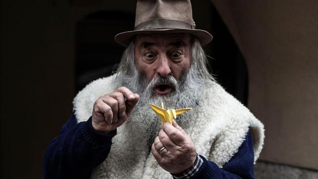 With his portly frame, bushy white beard and twinkling eyes, Italian toymaker and puppeteer Mario Collino could be a stand-in for Father Christmas. But while he too carts around bags of toys made in his workshop, Collino, who performs under the name “Prezzemolo” (Mister Parsley), is more of a Mister Geppetto, the fictional carver and father of the fairytale hero Pinocchio. (Marco Bertorello / AFP) With his portly frame, bushy white beard and twinkling eyes, Italian toymaker and puppeteer Mario Collino could be a stand-in for Father Christmas. But while he too carts around bags of toys made in his workshop, Collino, who performs under the name “Prezzemolo” (Mister Parsley), is more of a Mister Geppetto, the fictional carver and father of the fairytale hero Pinocchio. (Marco Bertorello / AFP)