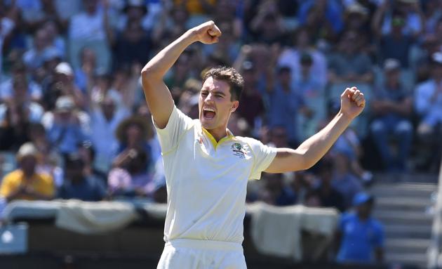 Australia's Pat Cummins reacts after dismissing India's Mayank Agarwal on day one of the third test match between Australia and India at the MCG in Melbourne. (REUTERS)