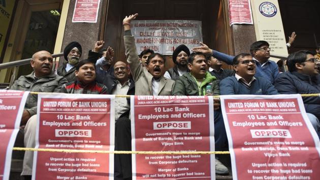 As many as 10 lakh employees of various public sector and some private and foreign banks are on a day-long strike to protest against the proposed merger of Vijaya Bank and Dena Bank with Bank of Baroda. The merged entity will have a combined business of Rs 14.82 trillion, making it the third largest bank after State Bank of India (SBI) and HDFC Bank. (Burhaan Kinu / HT Photo) As many as 10 lakh employees of various public sector and some private and foreign banks are on a day-long strike to protest against the proposed merger of Vijaya Bank and Dena Bank with Bank of Baroda. The merged entity will have a combined business of Rs 14.82 trillion, making it the third largest bank after State Bank of India (SBI) and HDFC Bank. (Burhaan Kinu / HT Photo)