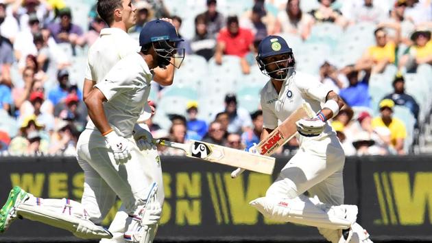 India's batsmen Virat Kohli and Cheteshwar Pujara run between the wickets during Day 1 of the third Test against Australia.(AFP) India's batsmen Virat Kohli and Cheteshwar Pujara run between the wickets during Day 1 of the third Test against Australia.(AFP)
