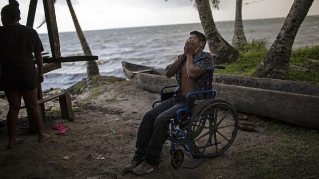 Charly was 16 and had harvested 60 pounds of lobster on the day in November 2017 that he was injured. Even now, after nine sessions, he hasn’t recovered. For a man who always made his living diving, it’s a nightmare being confined to a wheelchair. “I still can’t stand up by myself,” he said. “I can’t sit for a long time; after an hour my body hurts.” (Rodrigo Abd / AP)