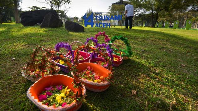 On Wednesday, thousands prayed for loved ones at mass graves and mosques to mark the 14th anniversary of the 2004 Boxing Day tsunami. It was one of the deadliest disasters in history, killing some 2,20,000 people in countries around the Indian Ocean, including some 1,68,000 Indonesians, most in Aceh at the northern tip of Sumatra. (Chaideer Mahyuddin / AFP) On Wednesday, thousands prayed for loved ones at mass graves and mosques to mark the 14th anniversary of the 2004 Boxing Day tsunami. It was one of the deadliest disasters in history, killing some 2,20,000 people in countries around the Indian Ocean, including some 1,68,000 Indonesians, most in Aceh at the northern tip of Sumatra. (Chaideer Mahyuddin / AFP)