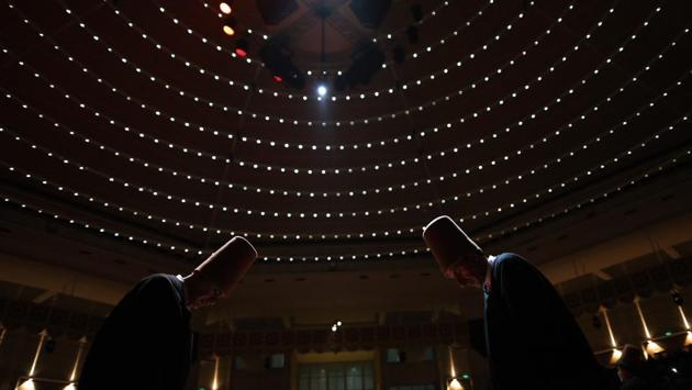 Whirling dervishes bow during a Sheb-i Arus ceremony. The dervishes wear long, conical headgear that symbolizes the tombstone. Their white, floating robes symbolize the shroud. (Lefteris Pitarakis / AP Photo) Whirling dervishes bow during a Sheb-i Arus ceremony. The dervishes wear long, conical headgear that symbolizes the tombstone. Their white, floating robes symbolize the shroud. (Lefteris Pitarakis / AP Photo)