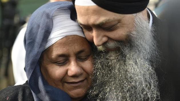 Nirpreet Kaur, an eye-witness of the 1984 anti-sikh riots, and AAP leader Jarnail Singh rejoice the Delhi High Court judgement sentencing Congress leader Sajjan Kumar to life imprisonment in connection with the massacre, at Delhi High Court, in New Delhi. (Sanchit Khanna / HT Photo) 