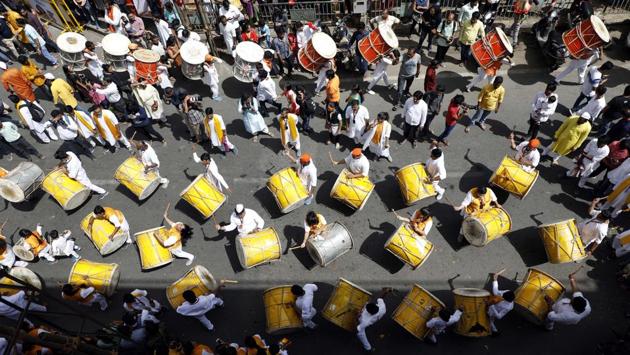 A dhol tasha troupe perform during the procession on the day of Ganesh Chaturthi at Laxmi road on 13th September. (RAHUl RAUT/HT PHOTO) 