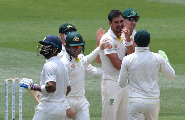 Australia's Mitchell Starc (3rd R) reacts after dismissing India's captain Virat Kohli (L) on day two of the third test match between Australia and India at the MCG in Melbourne. (REUTERS) Australia's Mitchell Starc (3rd R) reacts after dismissing India's captain Virat Kohli (L) on day two of the third test match between Australia and India at the MCG in Melbourne. (REUTERS)