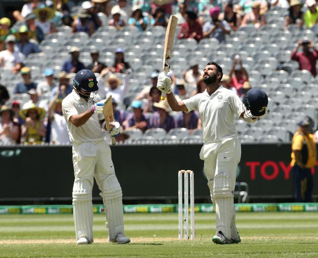 India's Cheteshwar Pujara (R) celebrates his century with captain Virat Kohli applauding on day two of the third test match between Australia and India at the MCG in Melbourne. (REUTERS) India's Cheteshwar Pujara (R) celebrates his century with captain Virat Kohli applauding on day two of the third test match between Australia and India at the MCG in Melbourne. (REUTERS)