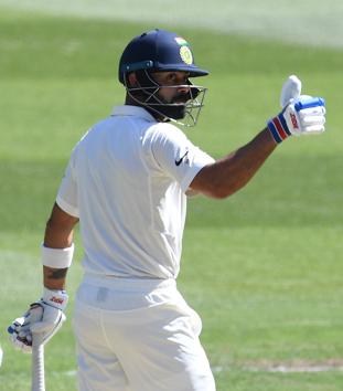India's captain Virat Kohli reacts after reaching 50 runs on day two of the third test match between Australia and India at the MCG in Melbourne. (REUTERS) India's captain Virat Kohli reacts after reaching 50 runs on day two of the third test match between Australia and India at the MCG in Melbourne. (REUTERS)