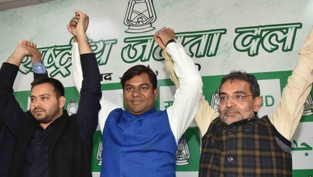 Patna: Mukesh Sahni, National President of the Vikasheel Insaan Party (VIP) raises hands with RJD's leader Tejashwi Yadav and Rashtriya Lok Samta Party (RLSP) leader Upendra Kushwaha after joining the grand alliance during a press conference in Patna. (HT File) Patna: Mukesh Sahni, National President of the Vikasheel Insaan Party (VIP) raises hands with RJD's leader Tejashwi Yadav and Rashtriya Lok Samta Party (RLSP) leader Upendra Kushwaha after joining the grand alliance during a press conference in Patna. (HT File)