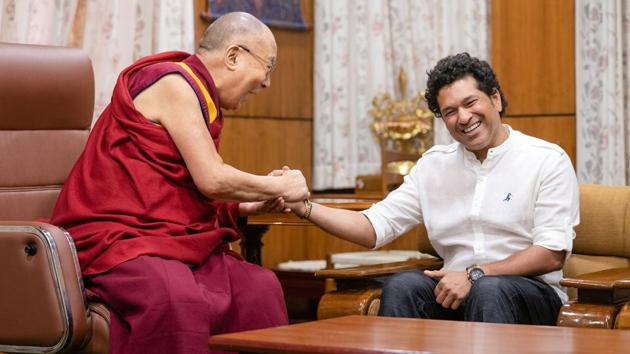 Former cricketer Sachin Tendulkar shares a light moment with Tibetan spiritual leader the Dalai Lama at McLeod Ganj, in Himachal Pradesh. (Shyam Sharma / HT Photo) 