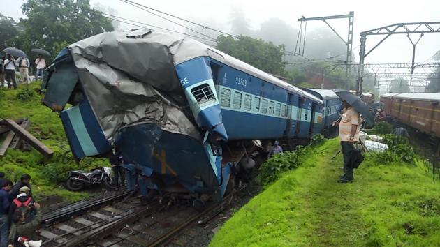 The Pune-Mumbai railway service has been disrupted due to an accident of The Madurai Chennai Egmore Express / Mahal Superfast Express (runs between Madurai Junction and Chennai Egmore) near the Khandala railway station. After the accident, some of the bogies rolled down, but luckily no one was injured in the accident . (Ht PHOTO) 
