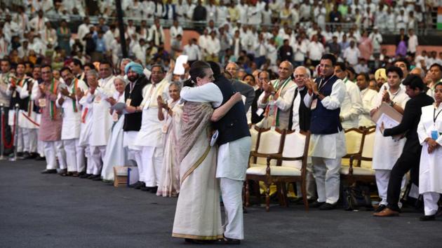 Congress President Rahul Gandhi hugs outgoing INC President Sonia Gandhi after her address during the Congress’ 84th Plenary Session, at Indira Gandhi Stadium, in New Delhi. Rahul Gandhi officially took the helm of India’s Grand Old Party at the event. (Mohd Zakir / HT Photo) 