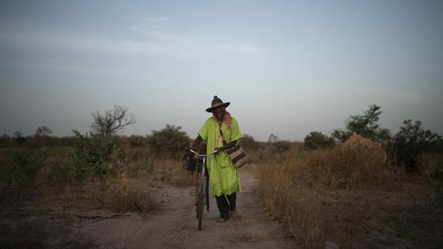 69-year-old Cheikh Fofana similarly grieves his son’s absence, refusing to officially acknowledge he is dead. Tidiane was one of 18 children — though the only one who noticed when his aging father or widowed aunt needed help. It was Tidiane who wanted to reach Europe to earn enough so that Fofana would never again have to ride his bicycle to the fields to work. (Felipe Dana / AP) 69-year-old Cheikh Fofana similarly grieves his son’s absence, refusing to officially acknowledge he is dead. Tidiane was one of 18 children — though the only one who noticed when his aging father or widowed aunt needed help. It was Tidiane who wanted to reach Europe to earn enough so that Fofana would never again have to ride his bicycle to the fields to work. (Felipe Dana / AP)