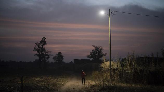 A boy stands under a street lamp at dusk in a village near Goudiry. A stranger answered the phone when Fofana called the line again. The man said Tidiane had left for Italy. “We’ve never had anyone tell us if this person is dead, if this person is alive, anything,” Fofana said. “I am always in doubt.” (Felipe Dana / AP) A boy stands under a street lamp at dusk in a village near Goudiry. A stranger answered the phone when Fofana called the line again. The man said Tidiane had left for Italy. “We’ve never had anyone tell us if this person is dead, if this person is alive, anything,” Fofana said. “I am always in doubt.” (Felipe Dana / AP)