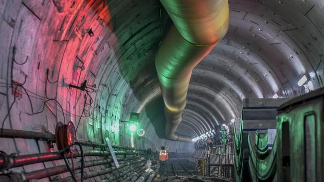 A worker during metro construction work in a tunnel at Azad Maidan in Mumbai, Maharashtra. In a major milestone in the construction of the city’s first underground Metro corridor, the first tunnel of the 33.5-km Colaba-Bandra-Seepz (Metro-3 line) was completed in September. (Kunal Patil / HT Photo) 