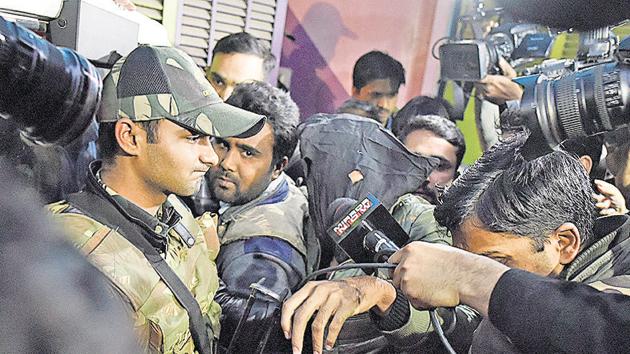 A boy arrested by the officials of National Investigation Agency during its raid, at Jaffrabad, Seelampur, in New Delhi, India, on Wednesday (Sanchit Khanna/HT PHOTO) A boy arrested by the officials of National Investigation Agency during its raid, at Jaffrabad, Seelampur, in New Delhi, India, on Wednesday (Sanchit Khanna/HT PHOTO)