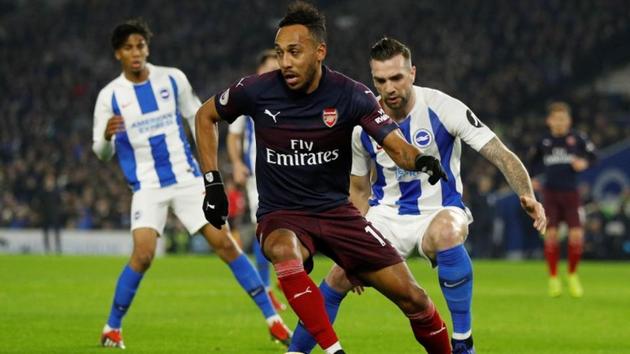 Arsenal's Pierre-Emerick Aubameyang in action with Brighton's Shane Duffy(REUTERS) Arsenal's Pierre-Emerick Aubameyang in action with Brighton's Shane Duffy(REUTERS)