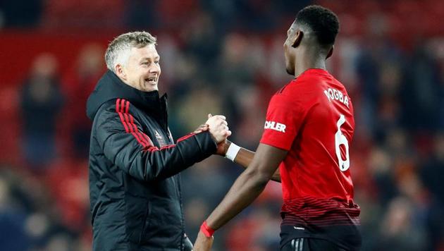 Manchester United's Paul Pogba and interim manager Ole Gunnar Solskjaer after the match(Action Images via Reuters)