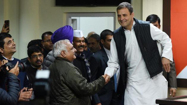Congress President Rahul Gandhi greets senior leader Bhupinder Singh Hooda before addressing a press conference at AICC headquarter after the party's victory in assembly elections in New Delhi. The party reversed its fortunes in election held in the states of Rajasthan, Madhya Pradesh and Chhattisgarh, boosting party morale ahead of the 2019 General elections. (Mohd Zakir / HT Photo) 