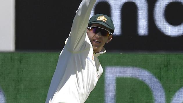 Australia's Tim Paine celebrates at the wicket of India's Mayank Agarwal during play on day one of the third cricket test between India and Australia in Melbourne.(AP)