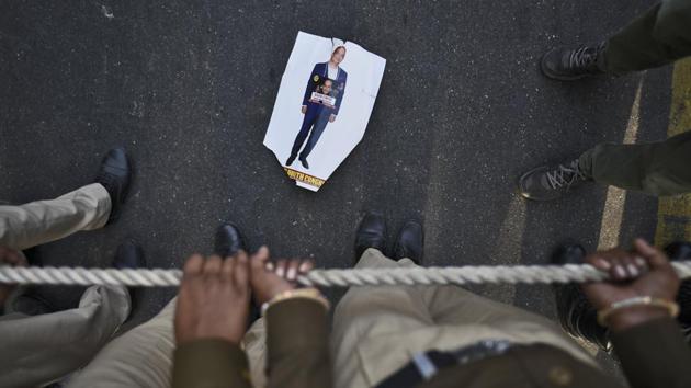 A poster of Nirav Modi lies on the ground during a protest march of the Indian Youth Congress at IYC office, in New Delhi. Modi and his uncle Mehul Choksi are accused of benefiting from a huge fraud against the Punjab National Bank, the country’s second largest lender, to the tune of more than $2 billion and have been absconding. (Burhaan Kinu / HT Photo) 