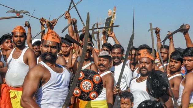 BJP supporters at a rally near Khurda, Odisha. The rally was addressed by Prime Minister Narendra Modi. (PTI) BJP supporters at a rally near Khurda, Odisha. The rally was addressed by Prime Minister Narendra Modi. (PTI)