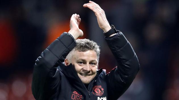 Manchester United interim manager Ole Gunnar Solskjaer celebrates defeating Huddersfield.(AP)