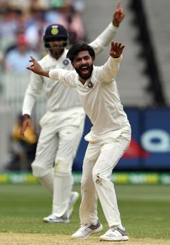 India's bowler Ravindra Jadeja shouts an unsuccessful leg before wicket appeal against Australia's batsman Travis Head during day three of the third cricket Test match between Australia and India in Melbourne. (AFP)
